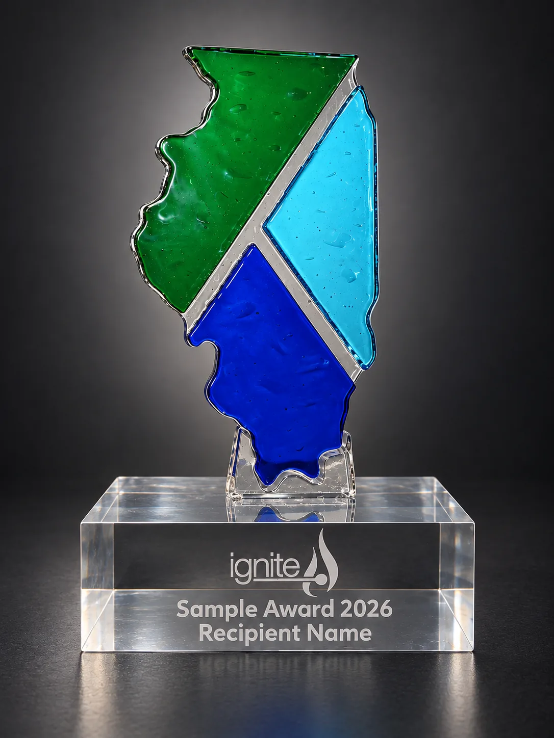 Illinois-shaped green, cyan and blue glass award on a clear acrylic base with a sample inscription.